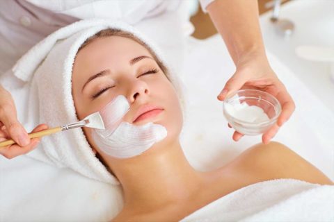 woman getting facial at spa