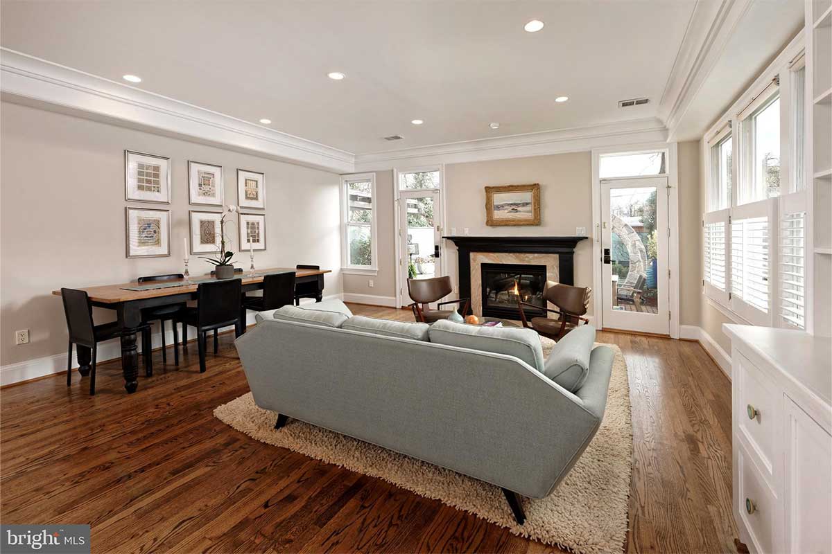 neutral living room with fireplace and hardwood floor