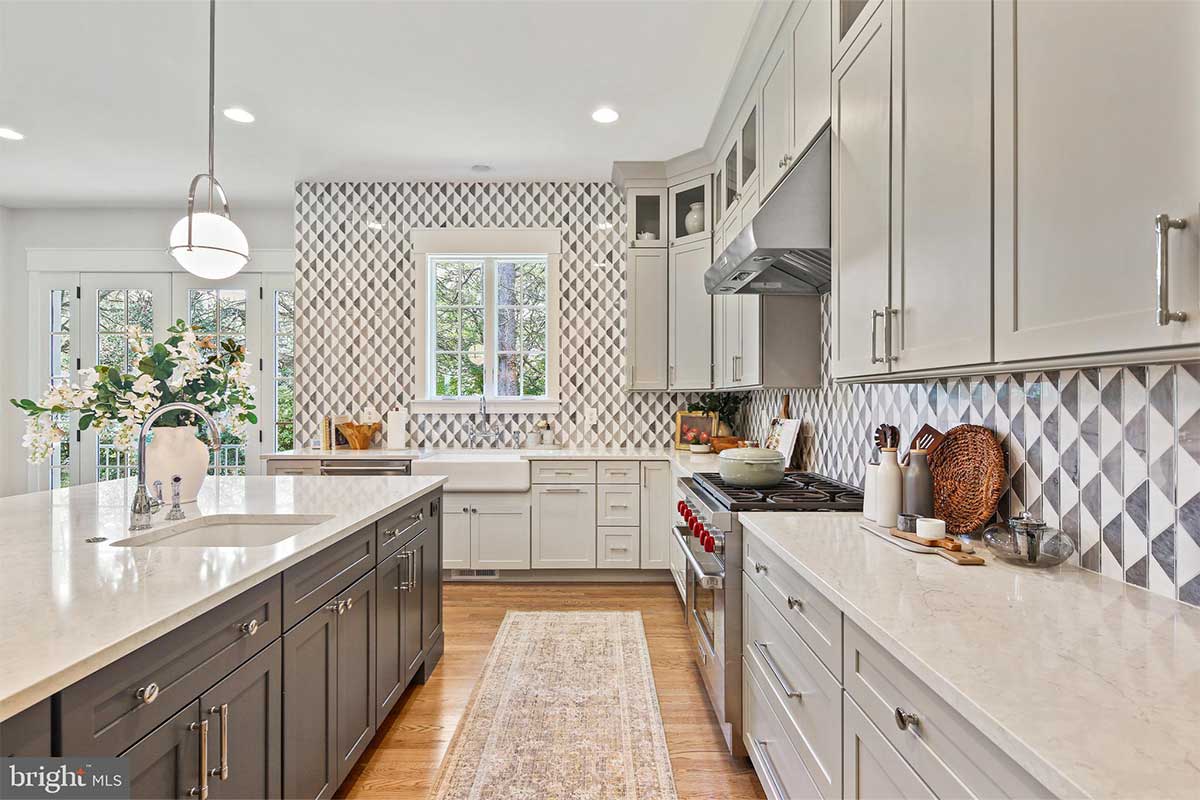 mclean kitchen with white cabinets and patterned backsplash