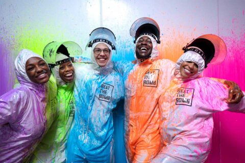 People covered in colorful paints at Beat the Bomb