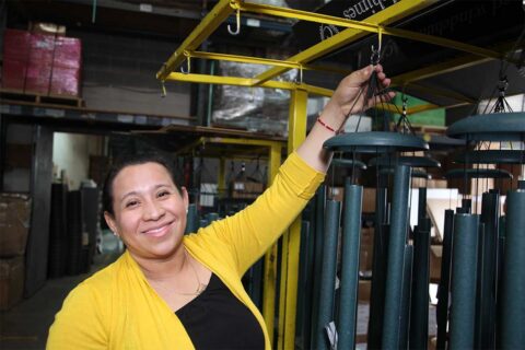 woman holding wind chimes