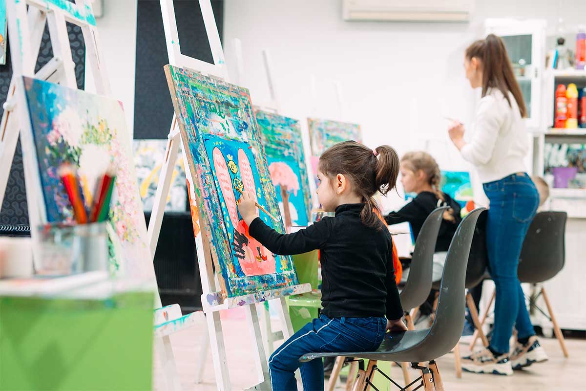 child painting at art studio
