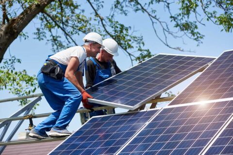 solar panel installation by 2 men