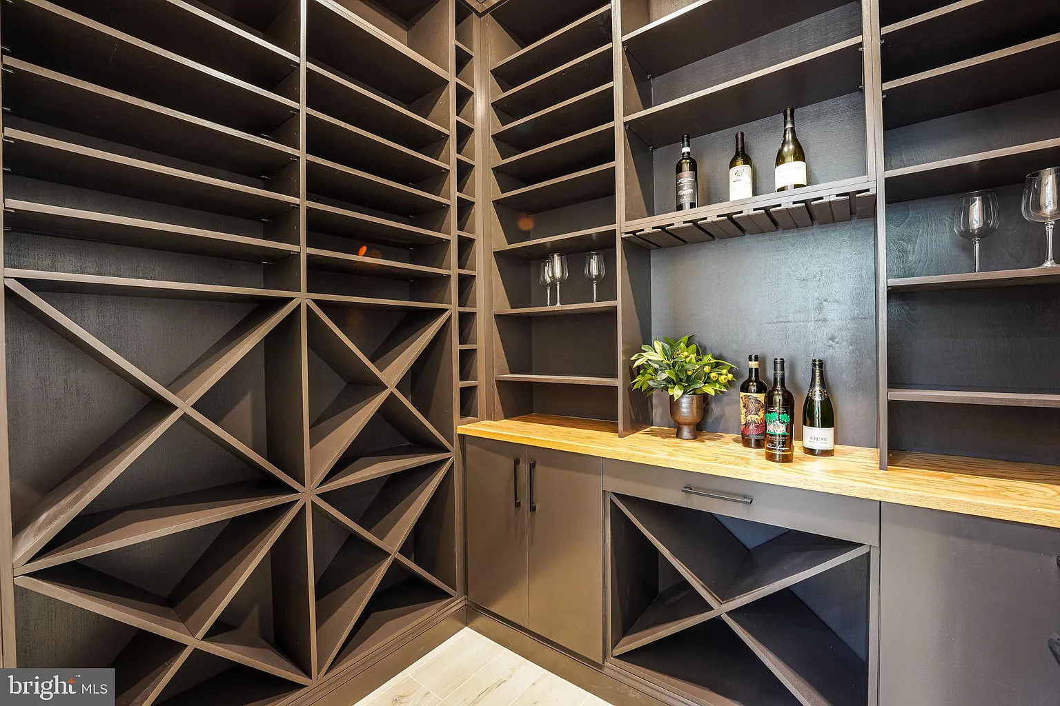 view of home's wine room with shelves and room for glass storage