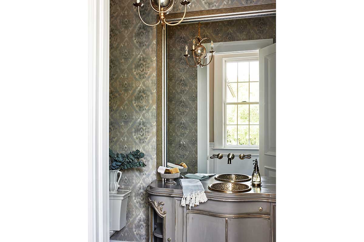 patterened bathroom with gold accents
