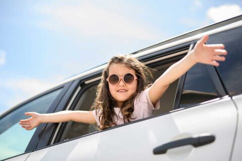 girl in car on vacation