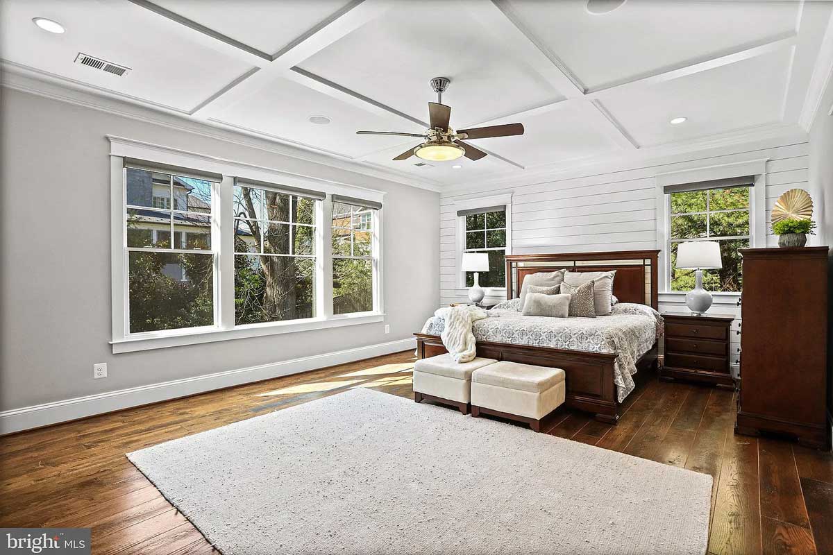 bedroom with wood floors and paneled ceiling