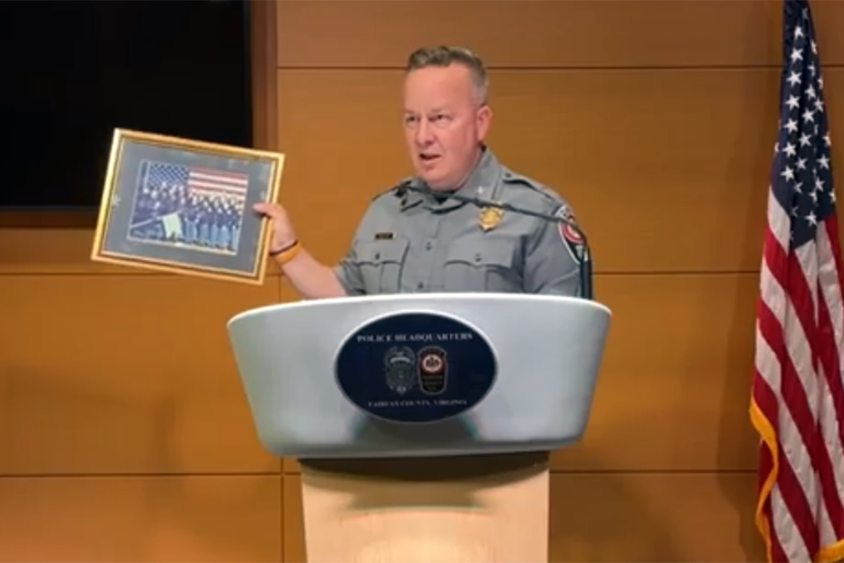Fairfax County Police Chief Kevin Davis holds up his academy class photo. (Photo courtesy Fairfax County Police Department)