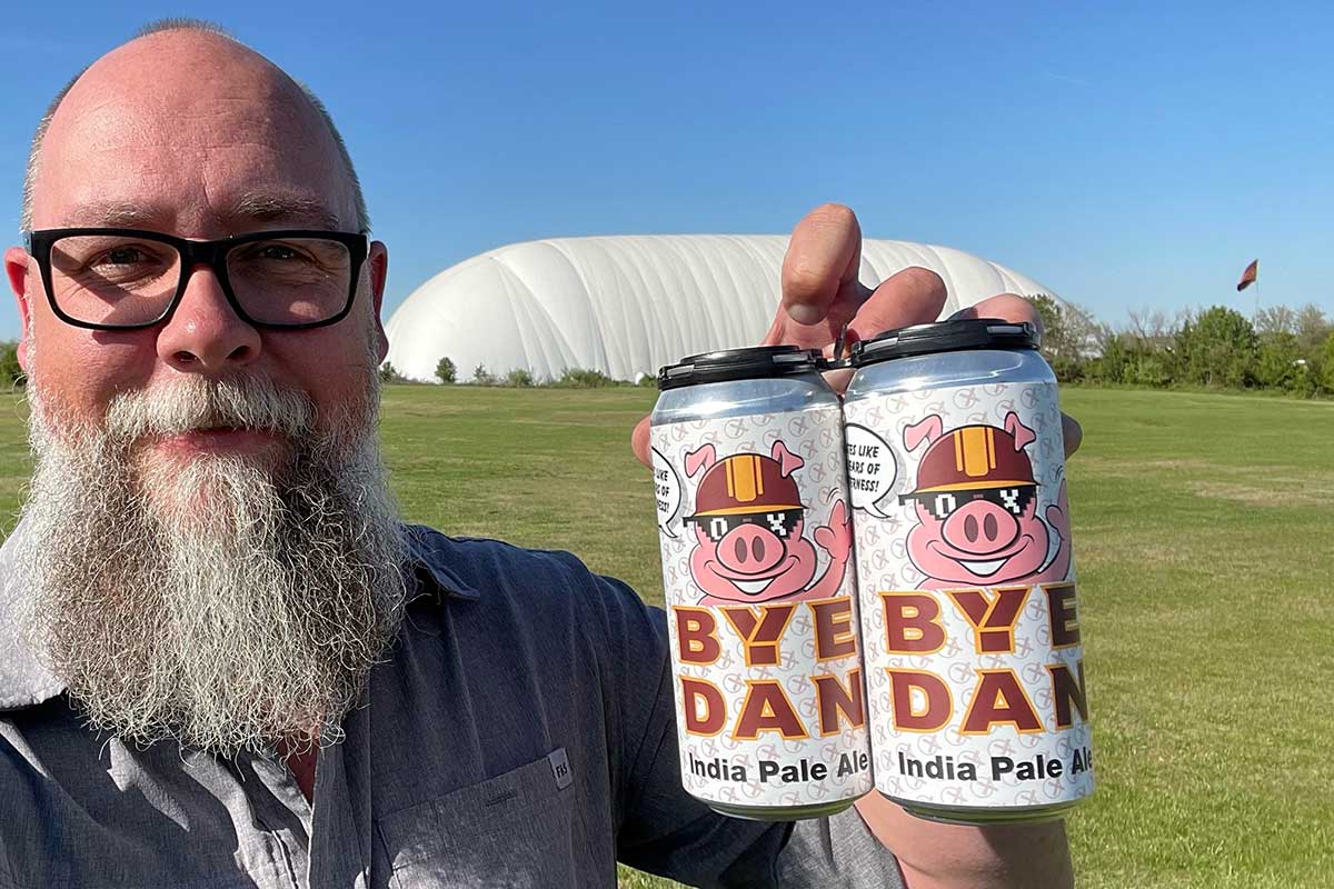 Chris Burns, president of Old Ox Brewery, holds "Bye Dan" beer. (Photo courtesy Chris Burns)
