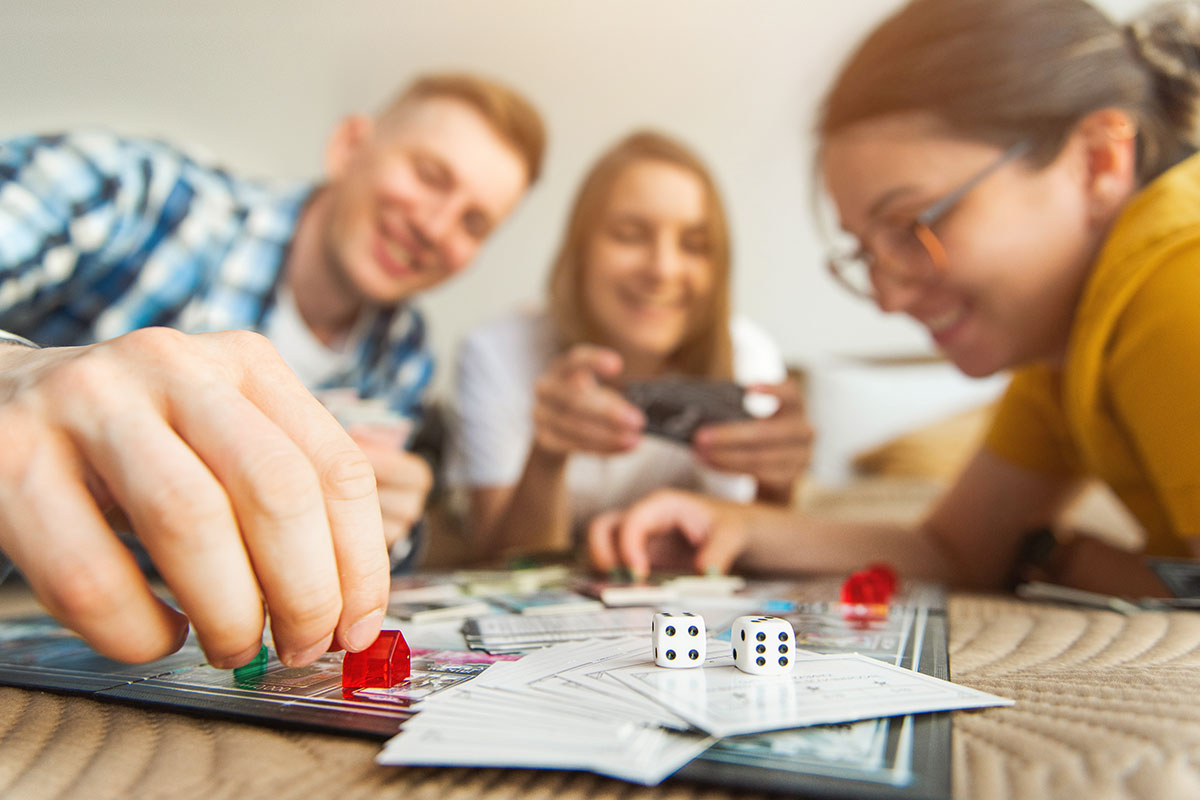 Group of people playing board game