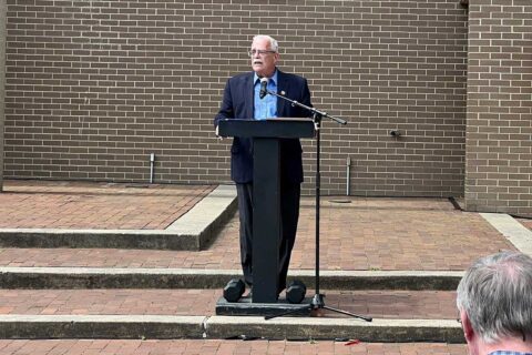 gerry connolly speaks standing at a podium