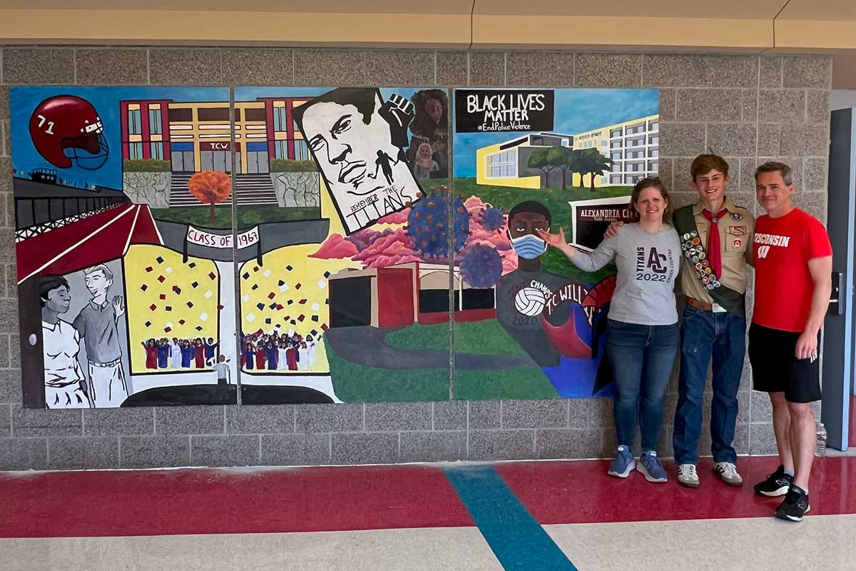 Emory Stouffer with Alexandria City High School mural and his parents, Heather and Craig Stouffer