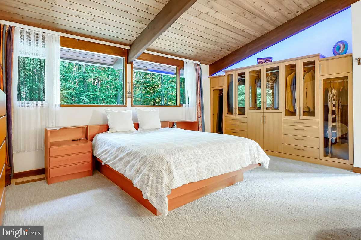 bedroom with wood paneled ceiling