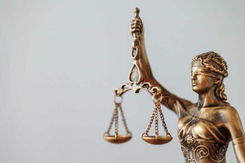 statuette of the goddess Themis judge's gavel