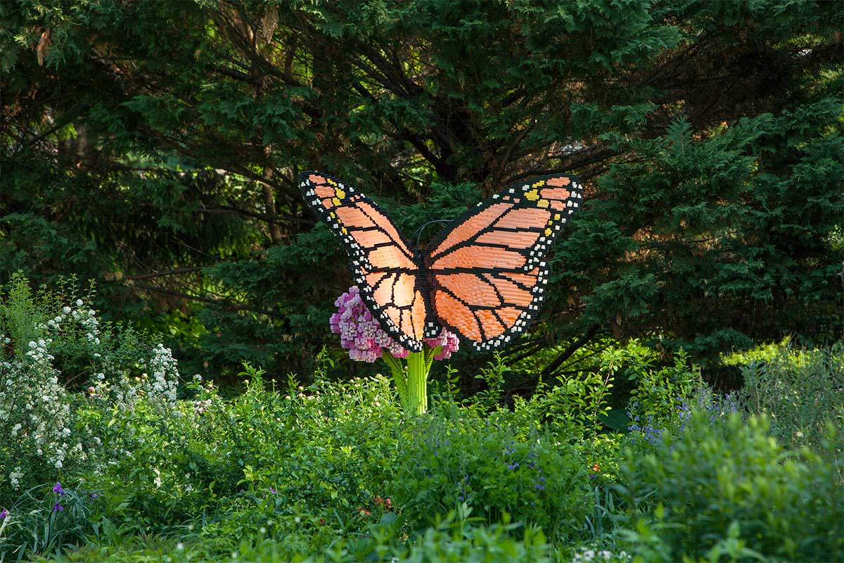lego butterfly sculpture in garden