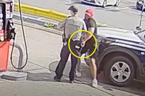 Screenshot of a man going for a Fairfax County police officer's gun on May 11
