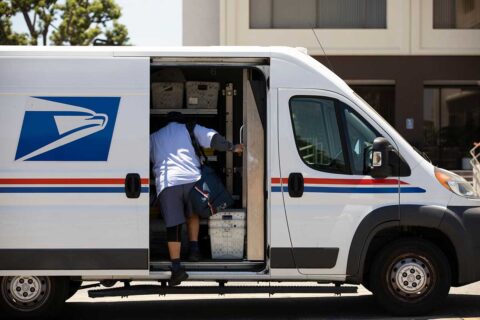 mailman getting into USPS truck