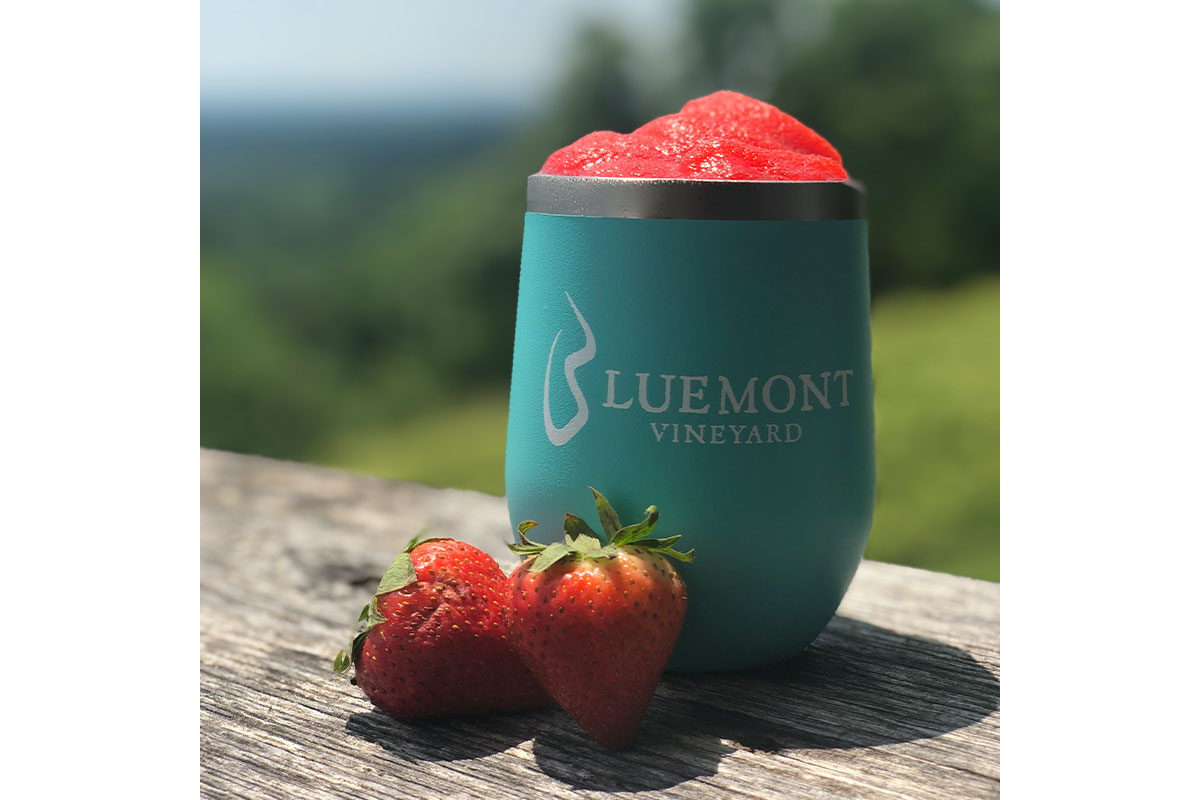 Frozen strawberry wine slush in insulated cup from Bluemont Vineyards