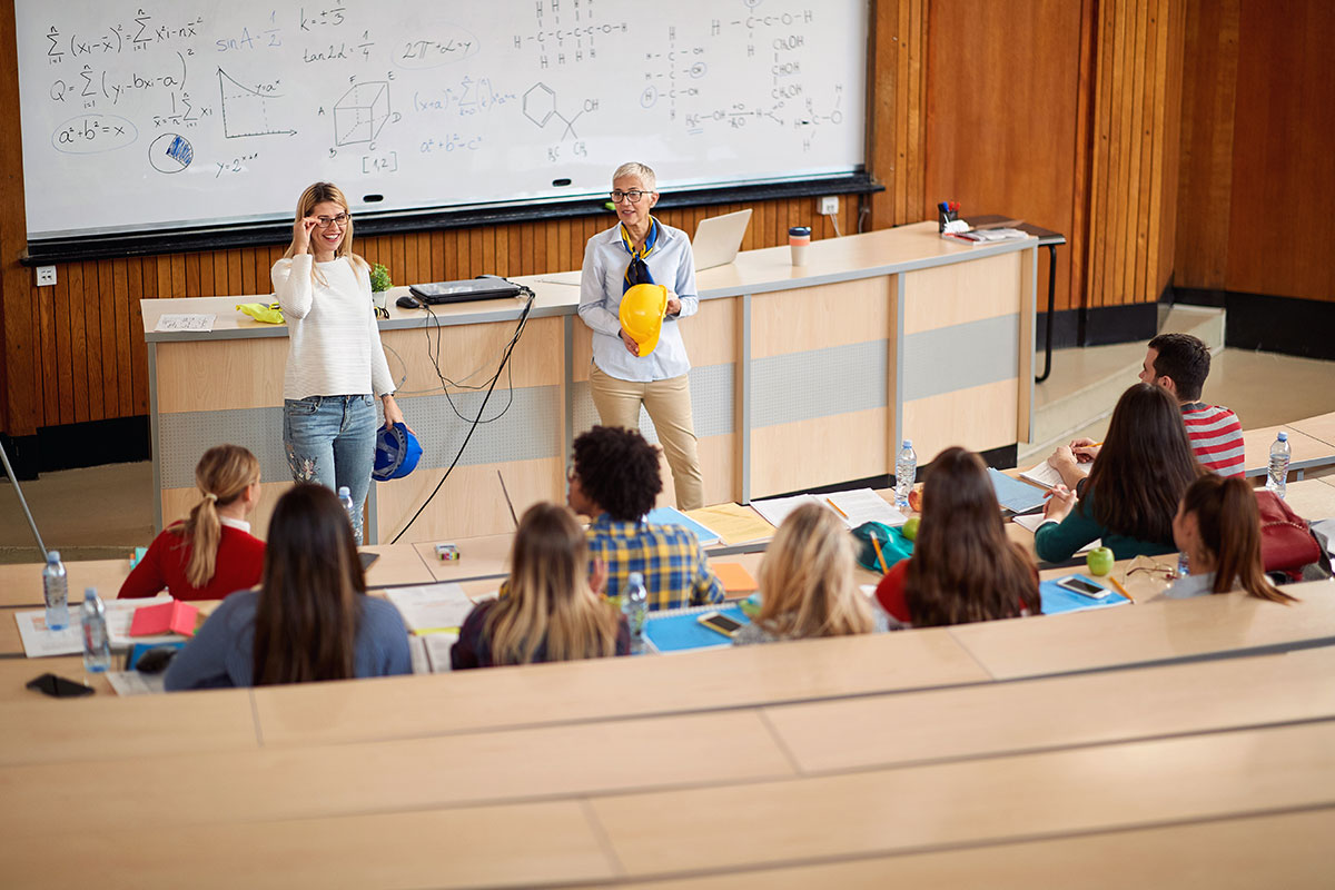 Professors lecturing to college classroom