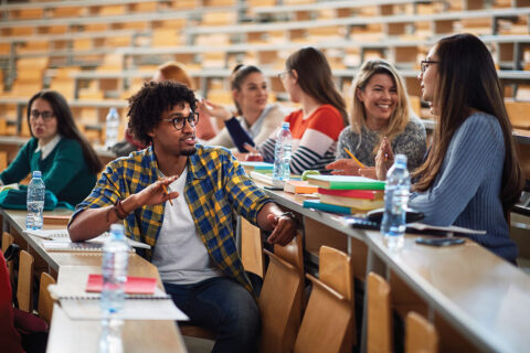 Students talking in college classroom