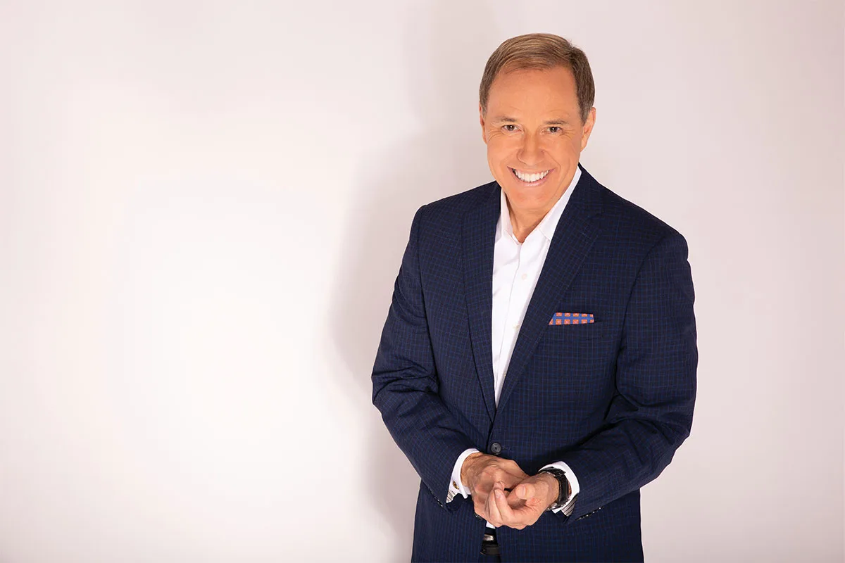 NBC4 news anchor Jim Handly in a suit against a gray background