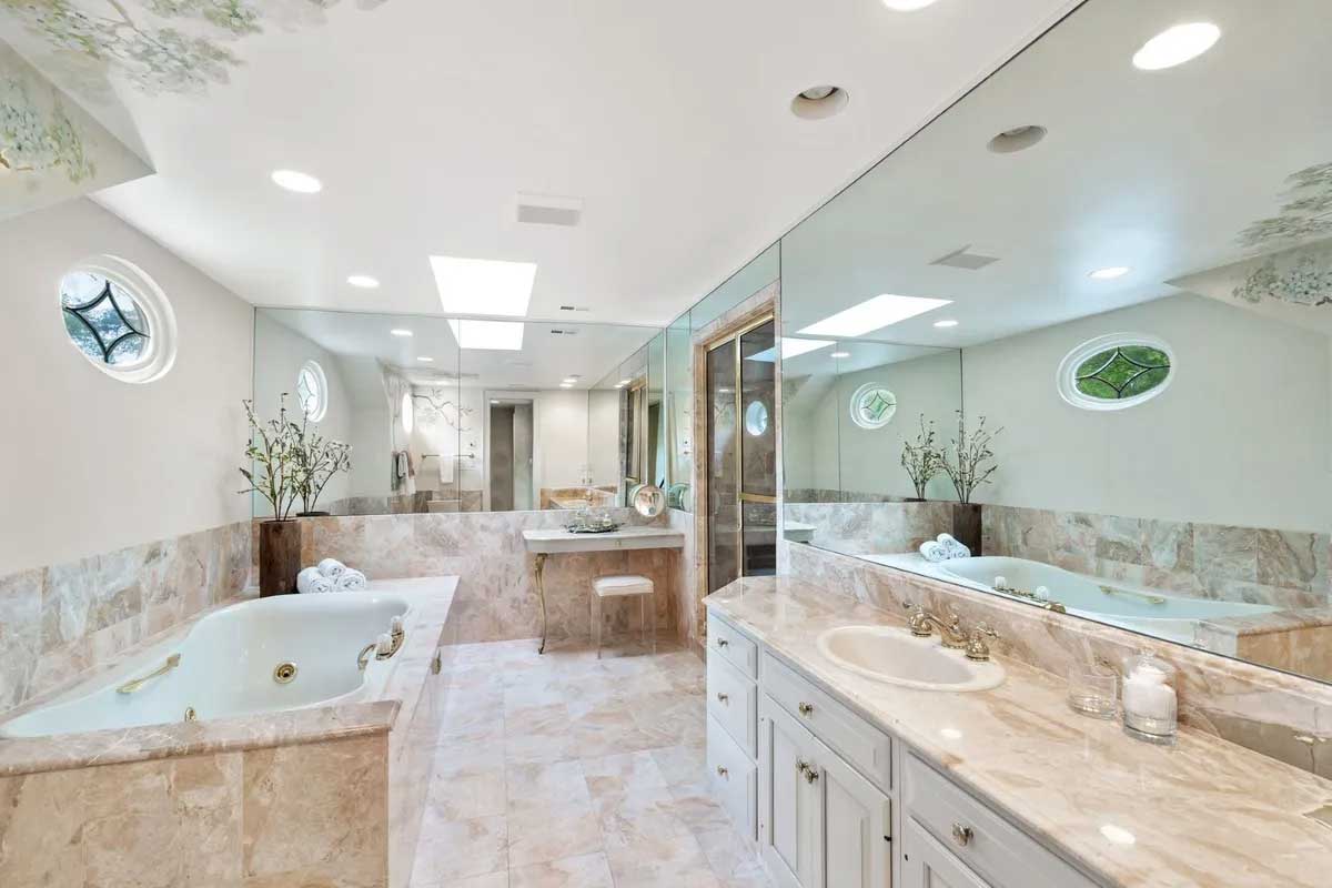 bathroom with marble floors and soaking tub 3059 Cedarwood Ln. in Falls Church.