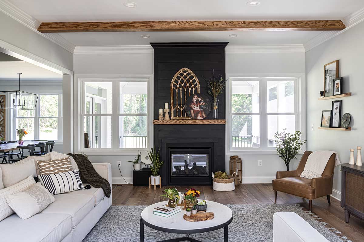 living room with black brick fireplace