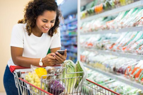woman in grocery store with cart
