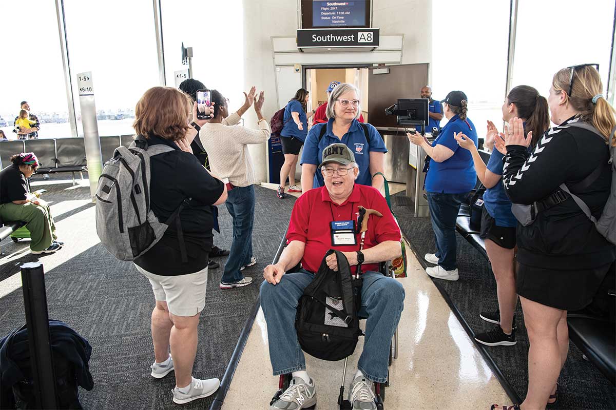 veteran in wheelchair coming off flight