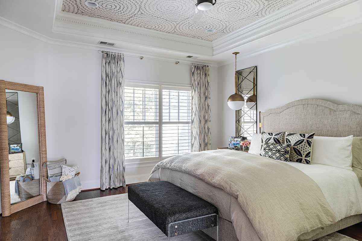 neutral colors and ceiling wallpaper in bedroom