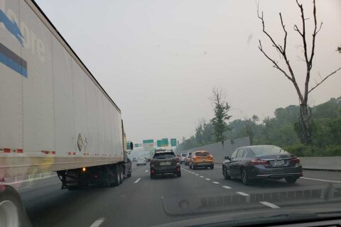 Hazy skies from the Canadian wildfires are seen on the Capital Beltway.