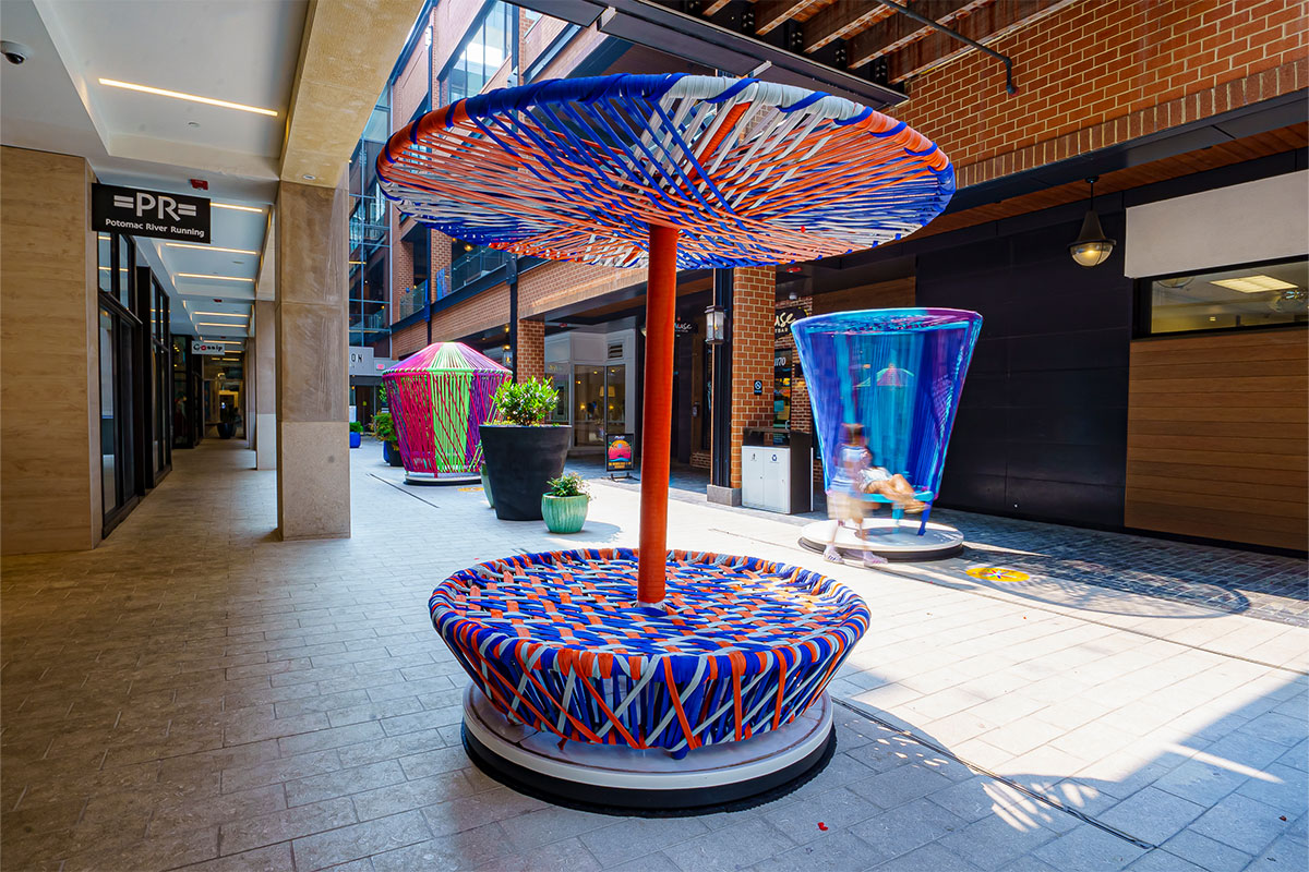Colorful spinning top art installation.