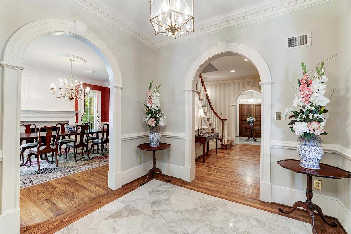 white entryway with arches