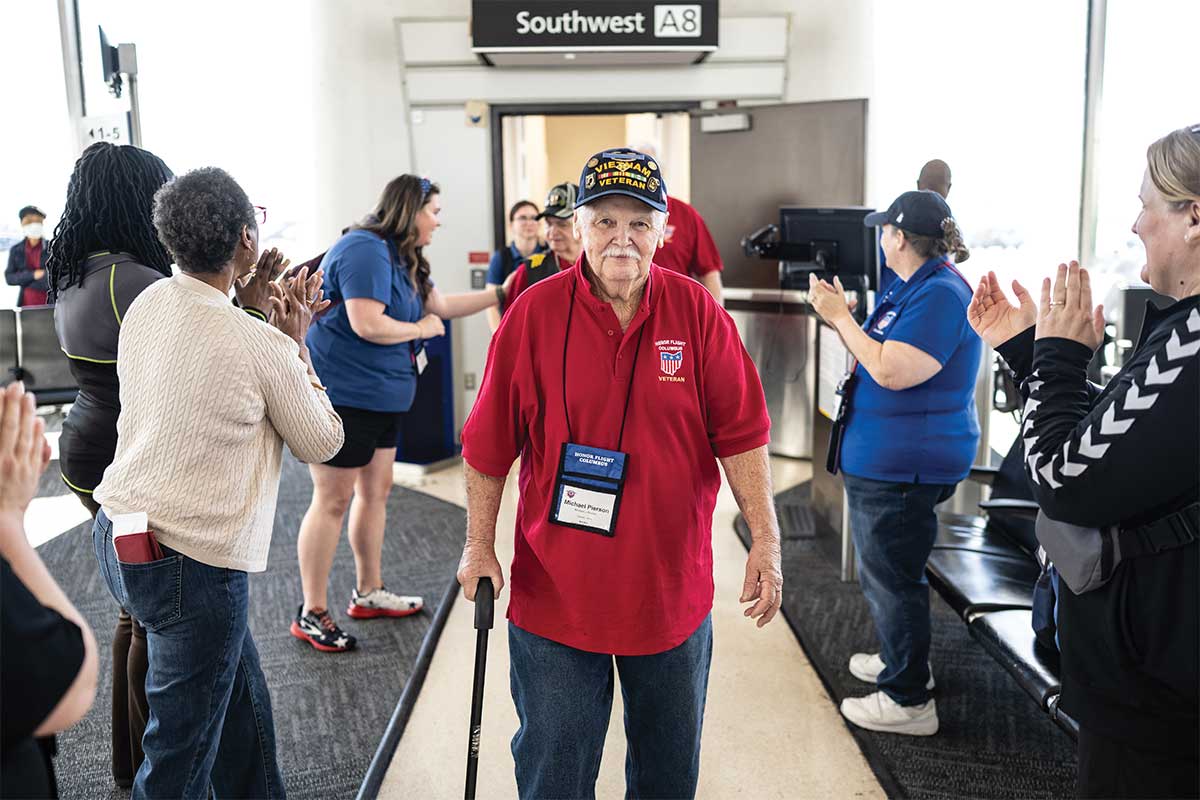 veteran walking off flight at Dulles