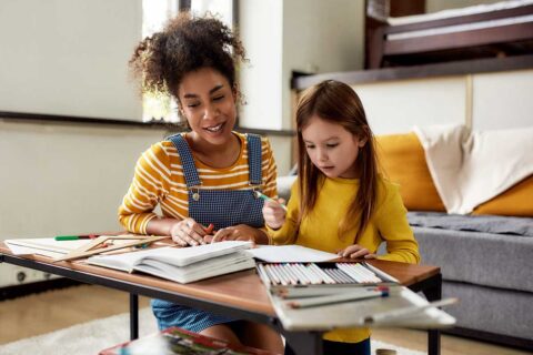 nanny coloring with little girl
