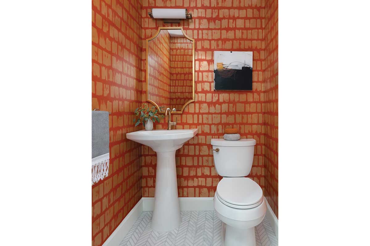 bathroom with orange wallpaper