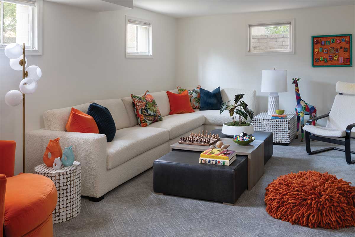 White living room with orange accents