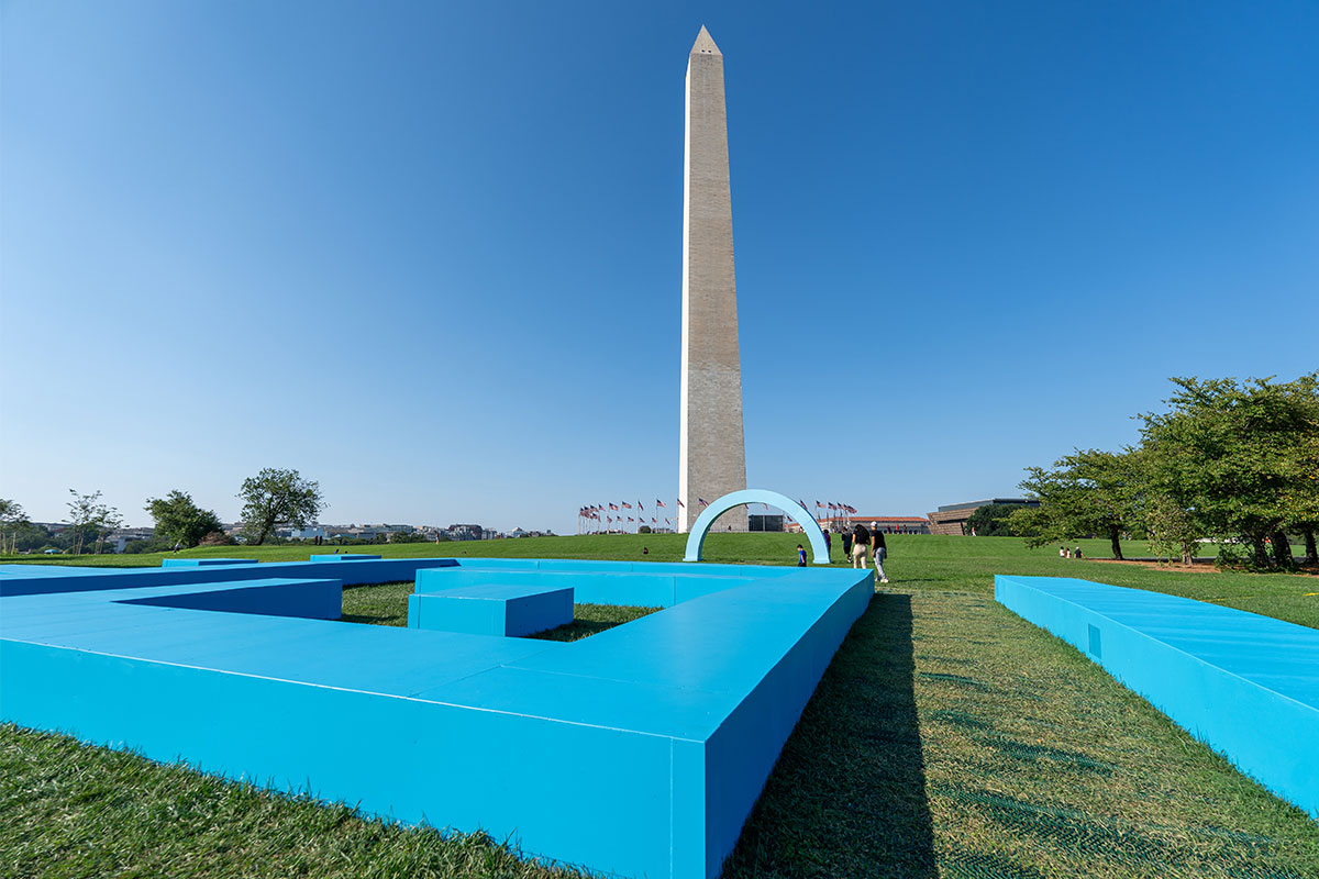 Large blue statue in front of Washington Monument