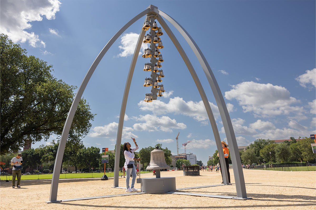 Tall metal structure with bells in the middle
