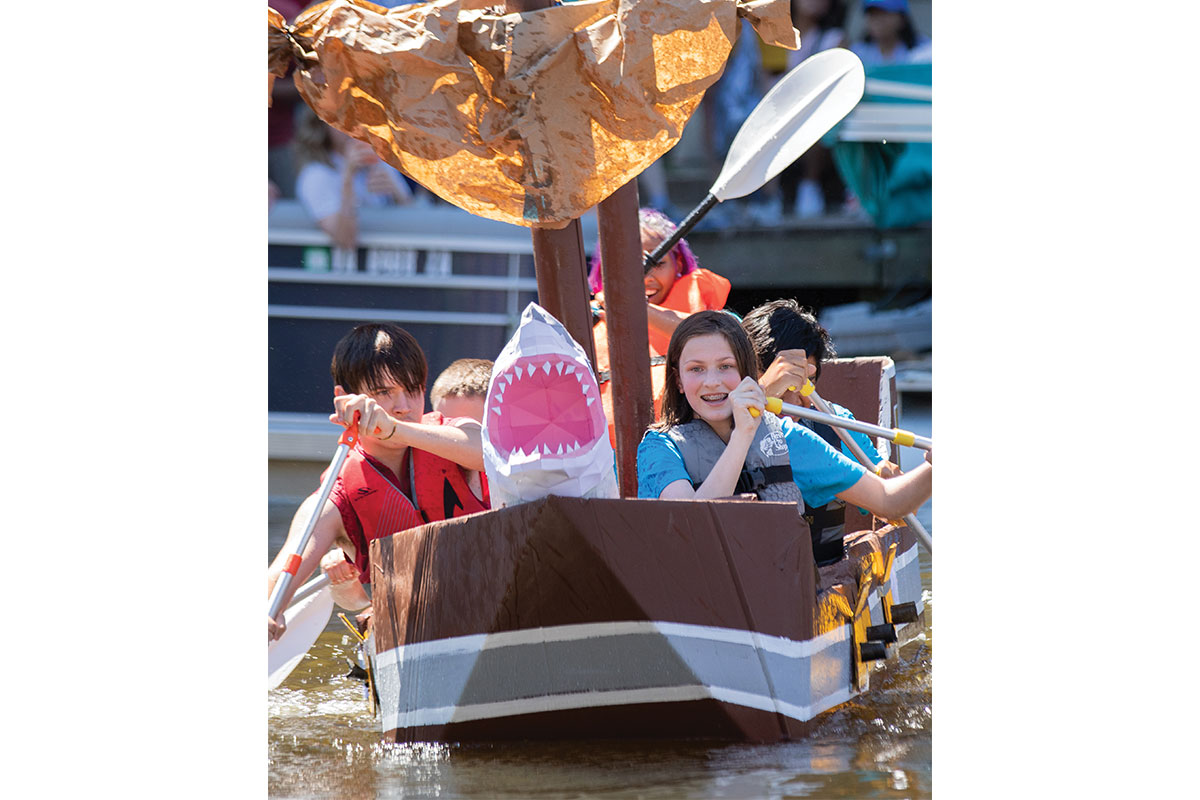 Cardboard boat with a shark head at the Cardboard Boat Regatta