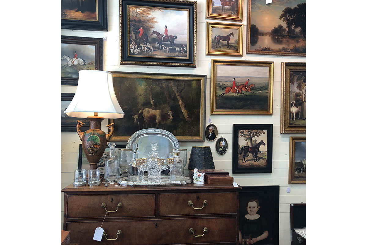Antique cabinet and paintings at The Fox & Pheasant