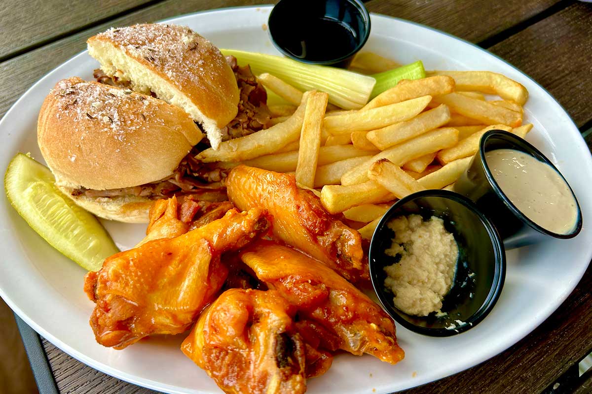 buffalo wings with fries and beef sandwich