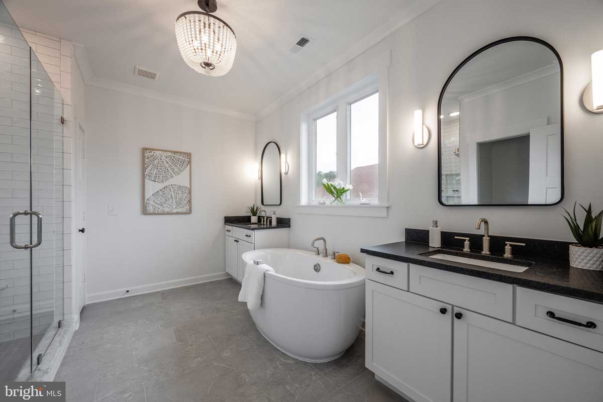 white bathroom with soaking tub and walk-in shower