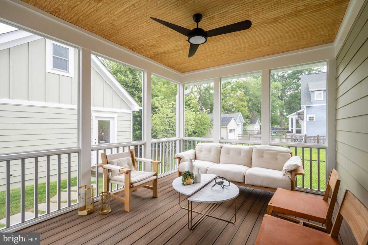 screened-in porch with ceiling fan