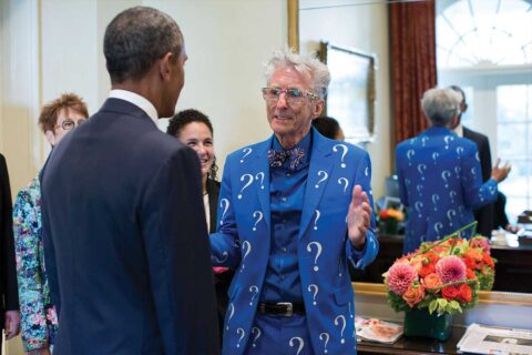 Matt Lesko in blue question mark suit meeting former president Barack Obama