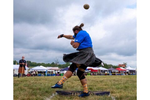 man throwing shot put