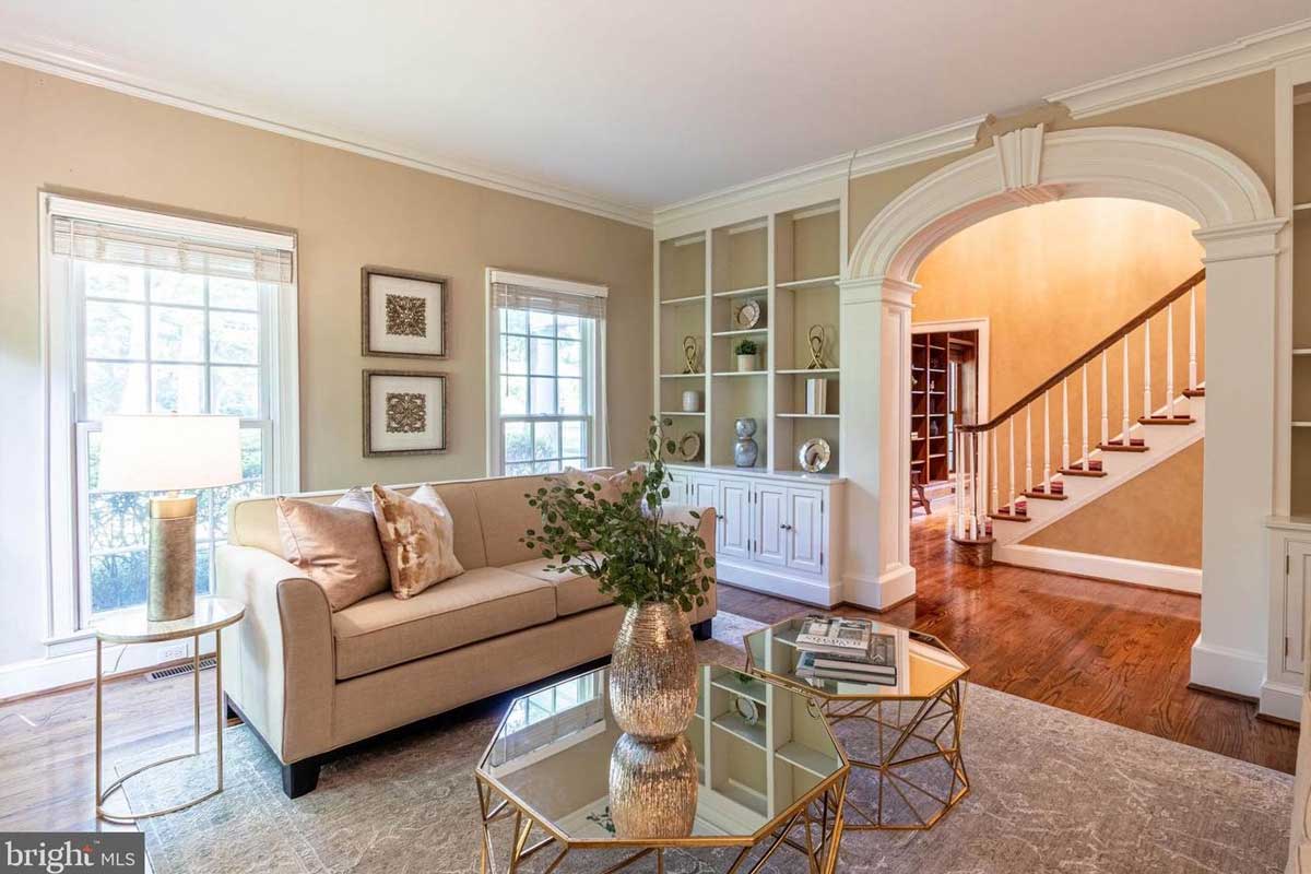 beige living room with curved arch doorway