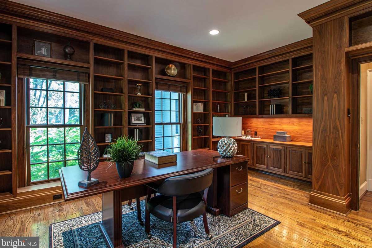 library with dark walnut shelves and desk
