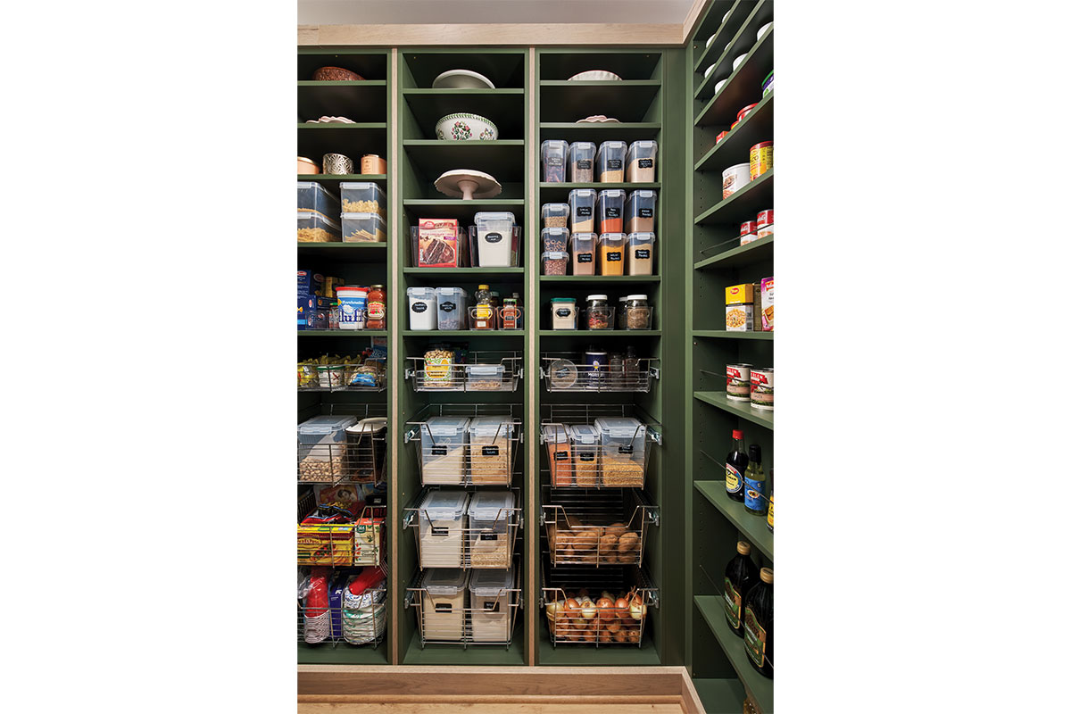 Pantry with green shelves and white oak accents