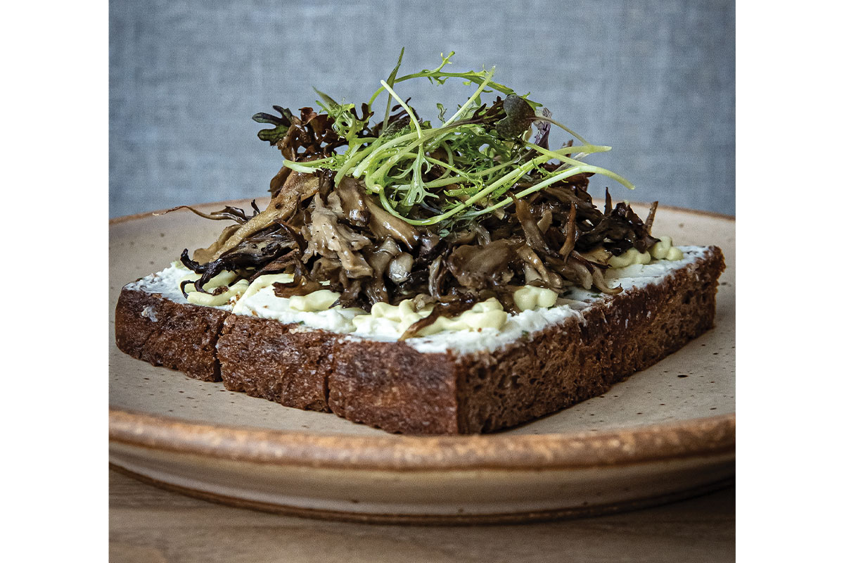 Bread with mushrooms and greens at Ellie Bird